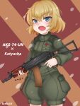  1girl aks-74u artist_name assault_rifle bangs blonde_hair blue_eyes bob_cut character_name commentary cowboy_shot eyebrows_visible_through_hair fang girls_und_panzer green_jumpsuit gun holding holding_gun holding_weapon jumpsuit kalashnikov_rifle katyusha_(girls_und_panzer) looking_at_viewer open_mouth petals pravda_military_uniform rifle short_hair short_jumpsuit skin_fang smile solo standing tacch weapon 