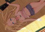  1girl blonde_hair blue_eyes blush breasts collarbone female holding large_breasts long_hair lying nintendo_switch on_back open_mouth original shorts solo sweat syurimp 
