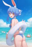  1girl alternate_costume alternate_hairstyle animal_ears ass bangs beach bikini bird blue_bikini blue_hair blue_sky blush breasts clouds cowboy_shot don-chan_(usada_pekora) from_side hair_bun halterneck highres holding holding_innertube hololive innertube looking_at_viewer multicolored_hair nousagi_(usada_pekora) ocean open_mouth rabbit_ears rabbit_girl rabbit_tail red_eyes sand short_eyebrows side-tie_bikini sky solo swimsuit tail thighs two-tone_hair upper_teeth usada_pekora virtual_youtuber water white_hair wrist_cuffs yihsien 