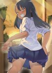  1girl black_hair blue_skirt blush brown_eyes clenched_teeth clouds dark-skinned_female dark_skin from_behind highres ijiranaide_nagatoro-san long_hair looking_at_viewer looking_back nagatoro_hayase orange_sky sakurami_sumi school_uniform shirt skirt sky smile solo sunset teeth thighs white_shirt 