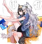 2girls animal_ears arknights arm_around_shoulder bare_legs barefoot black_hair black_shorts blue_shirt blush book closed_mouth commentary_request couch cup eyebrows_visible_through_hair fang grey_hair highres holding holding_book holding_cup lappland_(arknights) legs_up long_hair multiple_girls na_tarapisu153 on_couch open_mouth parted_lips shirt short_sleeves shorts sitting sitting_on_lap sitting_on_person skin_fang speech_bubble t-shirt tail texas_(arknights) translated wolf_ears wolf_girl wolf_tail yellow_eyes
