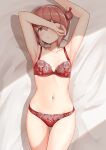  1girl ass_visible_through_thighs bed_sheet blush bra brown_eyes brown_hair collarbone cowboy_shot double_bun eyebrows_visible_through_hair hair_between_eyes highres kantai_collection navel panties parted_lips red_bra red_panties short_hair solo tan_yang_(kancolle) tears underwear underwear_only yukikaze_(kancolle) zuki 