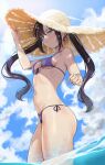  1girl :3 asymmetrical_bangs bangs bare_arms bare_shoulders bikini black_hair blue_sky blush breasts closed_mouth clouds cowboy_shot dappled_sunlight day earrings front-tie_bikini front-tie_top genshin_impact green_eyes hand_on_headwear hat highres jewelry long_hair looking_at_viewer medium_breasts mona_(genshin_impact) navel outdoors purple_bikini purple_ribbon ribbon ryudraw side-tie_bikini sidelocks signature sky smile solo straw_hat sunlight swimsuit symbol-only_commentary thighs twintails under_boob very_long_hair water yellow_headwear 