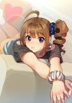  1girl ahoge arms_up bangs black_shirt blue_scrunchie blurry brown_hair closed_mouth commentary couch drill_hair eyebrows_visible_through_hair frown hair_ornament hair_scrunchie heart idolmaster idolmaster_million_live! kamille_(vcx68) looking_at_viewer lying medium_hair on_couch on_stomach orange_pants pants pillow print_scrunchie scrunchie shirt short_sleeves side_drill side_ponytail solo star_(symbol) star_print t-shirt violet_eyes white_scrunchie wrist_scrunchie yokoyama_nao 