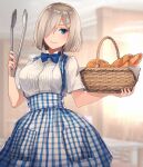  1girl basket blue_dress blue_eyes blush bow bowtie breasts closed_mouth commentary dirndl dress food german_clothes hair_ornament hair_over_one_eye hairclip hamakaze_(kancolle) highres holding holding_basket holding_food holding_tongs indoors kantai_collection kasumi_(skchkko) large_breasts looking_at_viewer plaid short_hair short_sleeves silver_hair solo standing 