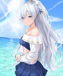  1girl anastasia_(fate) anastasia_(swimsuit_archer)_(fate) bangs bare_shoulders beach bikini blue_bikini blue_eyes blue_skirt blue_sky blush bow breasts collarbone fate/grand_order fate_(series) grin hair_bow hair_over_one_eye highres jewelry large_breasts long_hair long_sleeves looking_at_viewer miniskirt necklace ocean ozakinggg ponytail puffy_long_sleeves puffy_sleeves silver_hair skirt sky smile solo swimsuit very_long_hair 
