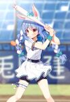  1girl animal_ears bangs baseball_bat baseball_bat_hair_ornament bike_shorts black_shorts blue_bow blue_hair blurry blurry_background blush bow braid commentary_request day depth_of_field eyebrows_visible_through_hair feet_out_of_frame grin hair_between_eyes hair_bow hands_up holding holding_baseball_bat hololive mauve multicolored_hair outdoors pleated_skirt rabbit_ears red_eyes shirt short_eyebrows short_shorts short_sleeves shorts shorts_under_skirt skirt smile solo standing sweatband thick_eyebrows twin_braids twintails two-tone_hair usada_pekora virtual_youtuber white_hair white_shirt white_skirt wristband 