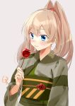  1girl bangs blonde_hair blue_eyes blush brown_background candy_apple food high_ponytail holding holding_food japanese_clothes kantai_collection kimono long_hair obi official_alternate_costume oriharaizaya819 ponytail sash simple_background solo upper_body victorious_(kancolle) wide_sleeves yukata 