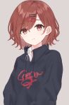  1girl expressionless eyebrows_visible_through_hair grey_background hair_ornament hairclip hairpin highres higuchi_madoka idolmaster idolmaster_shiny_colors looking_at_viewer mole mole_under_eye print_shirt red_eyes redhead shirt short_hair simple_background solo sweatshirt upper_body yazi114 