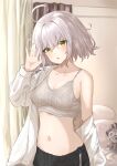  1girl absurdres ahoge bangs black_shorts bra breasts collarbone fate/grand_order fate_(series) highres indoors jeanne_d&#039;arc_(alter)_(fate) jeanne_d&#039;arc_(fate) kohaku_teru long_sleeves medium_breasts navel open_clothes open_shirt shirt short_hair shorts silver_hair solo tsurime underwear white_bra white_shirt yellow_eyes 