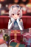  1girl bangs blue_bow blue_bowtie blush bow bowtie box center_frills commentary eyebrows_visible_through_hair fang frilled_hairband frills gift gift_box hairband hands_on_own_cheeks hands_on_own_face head_rest hololive horns kananote long_sleeves looking_at_viewer nakiri_ayame oni_horns open_mouth red_eyes shirt silver_hair sleeveless sleeveless_shirt smile solo table virtual_youtuber white_shirt 