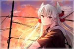  1girl amatsukaze_(kancolle) black_hoodie closed_mouth commentary evening eyebrows_visible_through_hair from_side grey_hair hair_ornament highres hood hoodie kahlumi kantai_collection long_hair long_sleeves looking_at_viewer smile solo sunset two_side_up upper_body yellow_eyes 