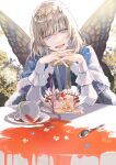  1boy blue_cape butterfly_wings cake cake_slice cape commentary_request crown diamond_hairband fairy fate/grand_order fate_(series) food fur-trimmed_cape fur_trim highres insect_wings looking_at_viewer male_focus oberon_(fate) open_mouth outdoors poppoman silver_hair sitting smile solo spill table teeth upper_teeth white_sleeves wings 