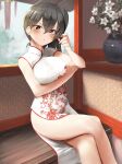  1girl alternate_costume black_hair blush breasts brown_eyes china_dress chinese_clothes crossed_legs dress eyebrows_visible_through_hair feet_out_of_frame flower hair_between_eyes highres honmakaina_kudou kaga_(kancolle) kantai_collection large_breasts long_hair parted_lips side_ponytail sitting sleeveless sleeveless_dress solo white_dress white_flower 