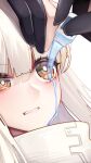  1girl arknights bangs binggong_asylum blush clenched_teeth commentary_request eyebrows_visible_through_hair high_collar highres long_hair platinum_(arknights) portrait pouring silver_hair simple_background solo_focus teeth uneven_eyes white_background yellow_eyes 