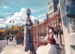  1girl architecture bangs blue_sky brown_hair building clouds cloudy_sky dress fence green_eyes grin highres lamppost long_hair looking_at_viewer outdoors red_vest rosa_(tears_of_themis) scenery short_sleeves sky smile solo tears_of_themis teeth tree vest white_dress yorktown_cv-5 