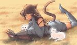  1girl absurdres animal_ears book brown_hair cat cat_ears cat_girl cat_tail detached_sleeves english_text feet_up grass green_eyes highres janespear long_hair looking_at_viewer lying on_stomach original solo strap strap_slip sweater tail thigh-highs 