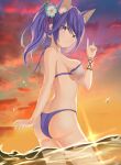  1girl animal_ears ass azur_lane bangs bikini blue_eyes blush breasts closed_mouth eyebrows_visible_through_hair fox_ears fox_shadow_puppet from_behind hair_ornament highres in_water jintsuu_(azur_lane) laura_jun looking_at_viewer medium_breasts outdoors ponytail purple_hair smile solo sunset swimsuit thighs water 