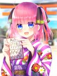  1girl :d bangs black_ribbon blue_eyes blunt_bangs blush butterfly_hair_ornament go-toubun_no_hanayome hair_ornament highres japanese_clothes kimono looking_at_viewer nakano_nino new_year obi omikuji outdoors pink_hair purple_kimono ribbon sash smile striped striped_kimono torii twintails xx_momomo_xx 