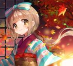  1girl bangs blunt_bangs blurry blurry_foreground blush bow brown_hair depth_of_field eyebrows_visible_through_hair falling_leaves floating_hair floral_print hair_bow highres idolmaster idolmaster_cinderella_girls japanese_clothes kimono leaf looking_at_viewer maple_leaf maple_tree motimotica obi ponytail print_kimono sash smile solo tied_hair tree upper_body yorita_yoshino 