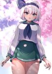  1girl :o alternate_costume arms_at_sides bangs black_headwear blunt_bangs blush bob_cut breasts cherry_blossoms commentary_request darumoon dot_nose eyebrows_visible_through_hair eyelashes ghost green_eyes green_skirt highres hitodama hitodama_print konpaku_youmu konpaku_youmu_(ghost) large_breasts long_sleeves looking_at_viewer miniskirt open_mouth petals sailor_collar school_uniform shiny shiny_skin short_hair skirt smile solo standing thick_thighs thighs touhou tree 