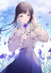  1girl :d aran_sweater bangs black_hair blue_eyes blue_sky clouds commentary_request day eyebrows_behind_hair floating_hair flower grey_sweater hands_up highres holding holding_flower jewelry long_hair long_sleeves looking_at_viewer myusha original outdoors petals pleated_skirt puffy_long_sleeves puffy_sleeves purple_flower purple_skirt ring skirt sky sleeves_past_wrists smile solo sweater very_long_hair 
