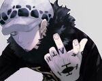  1boy chacoma fur_collar fur_hat grey_eyes hand_tattoo hand_up hat hat_over_one_eye highres looking_at_viewer male_focus one_piece simple_background smile solo tattoo trafalgar_law 