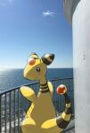  ampharos blue_eyes blush closed_mouth clouds commentary_request day fence looking_at_viewer looking_back no_humans outdoors photo_background pokemon pokemon_(creature) signature sky smile solo standing tansho water 