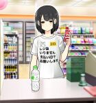  1girl black_hair blurry blurry_background bottle cellphone clothes_writing commentary convenience_store fukuda_ona highres holding indoors original phone shop short_hair smartphone solo translated water_bottle yellow_eyes 
