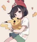  1girl bangs beanie blush bracelet closed_mouth eyelashes green_shorts grey_eyes hat heart highres holding holding_pokemon jewelry looking_at_viewer pikachu pokemon pokemon_(creature) pokemon_(game) pokemon_sm red_headwear selene_(pokemon) shirt short_shorts short_sleeves shorts smile symbol-only_commentary t-shirt tied_shirt z-ring zges 