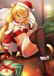  1girl bandeau bangs bell belt black_legwear blonde_hair blurry blurry_background box busou_kanojo christmas_tree detached_collar detached_sleeves fingerless_gloves fur_trim gift gift_box gloves hair_bun hat highres looking_at_viewer low_twintails mafuyu_anzu multicolored_hair namako_(namacotan) red_gloves sack santa_hat sitting skirt solo streaked_hair thigh-highs twintails virtual_youtuber yellow_eyes 