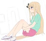  1girl blonde_hair blue_eyes blush braid closed_mouth copyright_request from_side green_shirt hugging_own_legs long_hair pink_shorts purple_footwear shirt shoes short_shorts short_sleeves shorts side_braid sincos sitting solo 