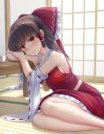  1girl arm_support ascot bangs bare_legs bare_shoulders blush bow breasts brown_hair choko_(cup) closed_mouth commentary_request cup detached_sleeves eyebrows_visible_through_hair feet_out_of_frame frilled_bow frilled_skirt frills hair_bow hair_tubes hakurei_reimu indoors long_hair long_sleeves looking_at_viewer medium_breasts medium_skirt nagiyamasugi on_floor red_bow red_shirt red_skirt shirt sideboob sidelocks sitting skirt sleeveless sleeveless_shirt smile solo table tatami touhou wide_sleeves yellow_ascot yellow_eyes yokozuwari 