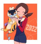  1girl 2022 blue_overalls border brown_hair chikorita commentary_request grin hands_up highres holding holding_pokemon long_hair lyra_(pokemon) miniature new_year no_hat no_headwear orange_background overalls pokemon pokemon_(creature) pokemon_(game) pokemon_hgss raikou red_shirt shirt smile twintails tyako_089 white_border 