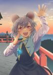 1girl :d animal_ears arm_up capelet glowing grey_hair highres jewelry looking_at_viewer mountainous_horizon mouse_ears mouse_tail nayozane_(worker7) nazrin outdoors pendant railing red_eyes short_hair smile solo sunset tail touhou waving 