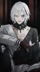  1boy arm_on_knee arm_rest black_shirt black_streaks blue_eyes eyelashes gi_ra1 grey_hair hair_between_eyes heterochromia highres knee_up knees_up long_sleeves looking_at_viewer male_focus multicolored_hair official_alternate_costume parted_lips puffy_long_sleeves puffy_sleeves punishing:_gray_raven roland:_flambeau_(fool's_fables)_(pgr) roland_(pgr) shirt short_hair sitting sleeve_cuffs smile solo streaked_hair two-tone_shirt white_shirt yellow_eyes 