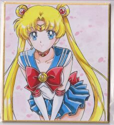 1girl back_bow bishoujo_senshi_sailor_moon blonde_hair blue_eyes blue_sailor_collar blue_skirt bow breasts chikoto_(kztc4472) choker circlet closed_mouth collarbone commentary cowboy_shot crescent crescent_choker crescent_earrings double_bun earrings elbow_gloves gem gloves gold_circlet hair_bun hair_ornament highres jewelry leaning_forward leotard lips long_hair looking_at_viewer magical_girl medium_breasts miniskirt parted_bangs photo_(medium) picture_frame pink_background pleated_skirt red_bow red_choker red_gem red_trim sailor_collar sailor_moon sailor_senshi_uniform short_sleeves skirt smile solo standing traditional_media transformation_brooch_(sailor_moon) tsukino_usagi twintails very_long_hair white_gloves white_leotard 