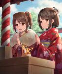 2girls :d absurdres blue_flower blurry blurry_background blurry_foreground braid brown_eyes brown_hair brown_kimono closed_mouth commentary_request day depth_of_field floral_print flower fur_collar hair_flower hair_ornament hatsumoude highres japanese_clothes kimono long_sleeves multiple_girls obi original outdoors palms_together print_kimono red_flower red_kimono sash smile tsunenorip twintails wide_sleeves 