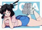  1girl artist_name ass black_hair blue_background blue_shorts borrowed_character brown_eyes crop_top full_body highres lucia_(scott_malin) lying medium_hair midriff on_stomach original parted_lips pink_shirt print_shirt purinworks shirt shoes short_sleeves shorts smile socks solo white_footwear 