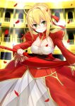  1girl ahoge blonde_hair blurry breasts chiakisuzuya cleavage corset fate/extra fate/grand_order fate_(series) flower green_eyes hair_flower hair_ornament highres looking_at_viewer nero_claudius_(fate)_(all) ocean petals saber_extra short_hair smile solo 