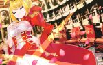  1girl ahoge blonde_hair blurry breasts cleavage corset fate/extra fate/grand_order fate_(series) flower green_eyes hair_flower hair_ornament highres looking_at_viewer nero_claudius_(fate)_(all) ocean petals phibonnachee saber_extra short_hair smile solo 