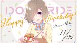  1girl birthday bow brown_hair eyebrows_visible_through_hair food hair_over_one_eye happy_birthday highres idoly_pride looking_at_viewer official_art open_mouth qp:flapper shiraishi_chisa short_hair smile solo violet_eyes 