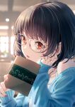  1girl bangs bare_shoulders black_hair blue_cardigan blurry blurry_background book camisole cardigan collarbone glasses hand_on_own_face hand_up highres holding holding_book hyuuga_azuri indoors jewelry long_sleeves necklace original parted_lips red_eyes short_hair solo white_camisole 