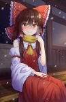  1girl ascot bangs bow breath brown_hair closed_mouth detached_sleeves eyebrows_visible_through_hair hair_bow hakurei_reimu highres looking_at_viewer medium_hair multicolored_eyes nontraditional_miko outdoors red_bow red_eyes red_shirt red_skirt scarf shirt skirt smile snowing solo touhou wide_sleeves yellow_ascot yellow_eyes yellow_scarf yosshy 
