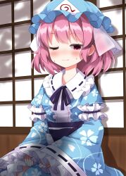  1girl blue_hat blue_kimono blush breasts closed_mouth commentary_request completion_time frilled_kimono frills hat highres japanese_clothes kimono long_sleeves medium_breasts medium_hair mob_cap neck_ribbon obi one_eye_closed petal_print pink_eyes pink_hair print_kimono purple_ribbon purple_sash ribbon ribbon-trimmed_collar ribbon-trimmed_sleeves ribbon_trim ruu_(tksymkw) saigyouji_yuyuko sash shadow shouji sitting sleeve_garter sliding_doors smile solo sweat touhou triangular_headpiece wide_sleeves 