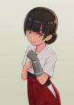  1girl bangs blunt_bangs brown_hair commentary_request double_bun dougi gloves grey_background grey_gloves hakama highres japanese_clothes kantai_collection looking_at_viewer orange_eyes porupurucha red_hakama simple_background single_glove smile solo yawata_maru_(kancolle) 