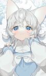  1girl absurdres animal_ears bangs blue_eyes cat_ears cat_girl closed_mouth commission eyebrows_visible_through_hair hands_up highres looking_at_viewer lying mono_(mono_zzz) on_back original paw_pose silver_hair sleeves_past_fingers sleeves_past_wrists smile solo upper_body 