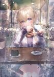  1girl absurdres bangs black_sweater blonde_hair blue_eyes blurry blurry_background bokeh building cafe city_lights coat commentary crossed_bangs cup dentaku_music depth_of_field eyebrows_visible_through_hair hair_between_eyes highres holding holding_cup indoors legs_together light_blush long_hair looking_at_viewer night original parted_lips rain reflection sitting solo sweater table water_drop white_coat 