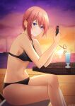  1girl absurdres bangs bikini black_bikini blue_eyes breasts crazy_straw cup drinking_glass drinking_straw earrings eyebrows_visible_through_hair go-toubun_no_hanayome heart_straw hidel highres jewelry large_breasts nakano_ichika navel ocean pink_hair ship short_hair sideboob sitting sky smile solo sun sunset swimsuit watercraft 