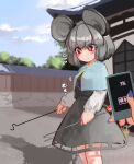  1girl animal_ears bangs blush breast_expansion commentary cowboy_shot dowsing_rod dress eyebrows_visible_through_hair gold_trim grey_dress grey_hair grey_skirt highres holding holding_phone holding_with_tail jewelry long_sleeves medium_hair mouse_ears mouse_girl mouse_tail nazrin pendant phone prehensile_tail red_eyes skirt standing tail touhou zakozako_y 